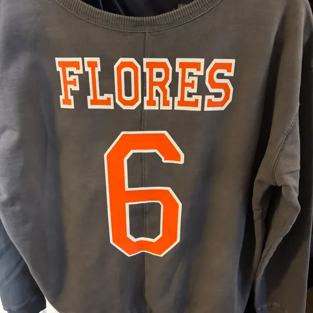 Charcoal long-sleeve jersey with FLORES and the number 6 in orange lettering